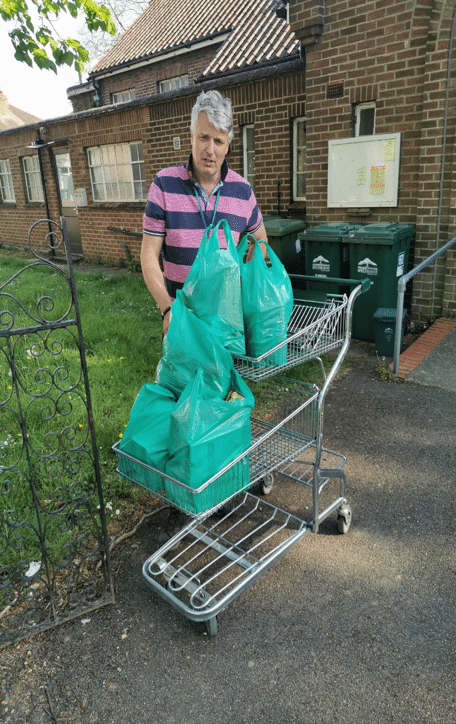Manna Food Bank volunteer delivers a parcel