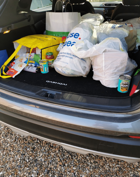 Collecting donations from boxes in local shops